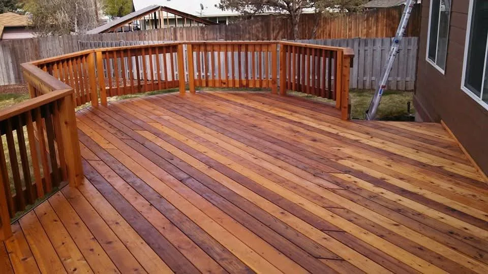 Finished wood deck with a matching railing